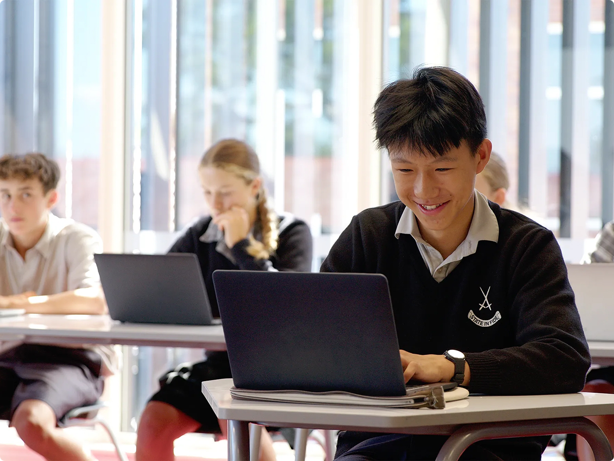 A classroom of Australian students learning to write with their teacher